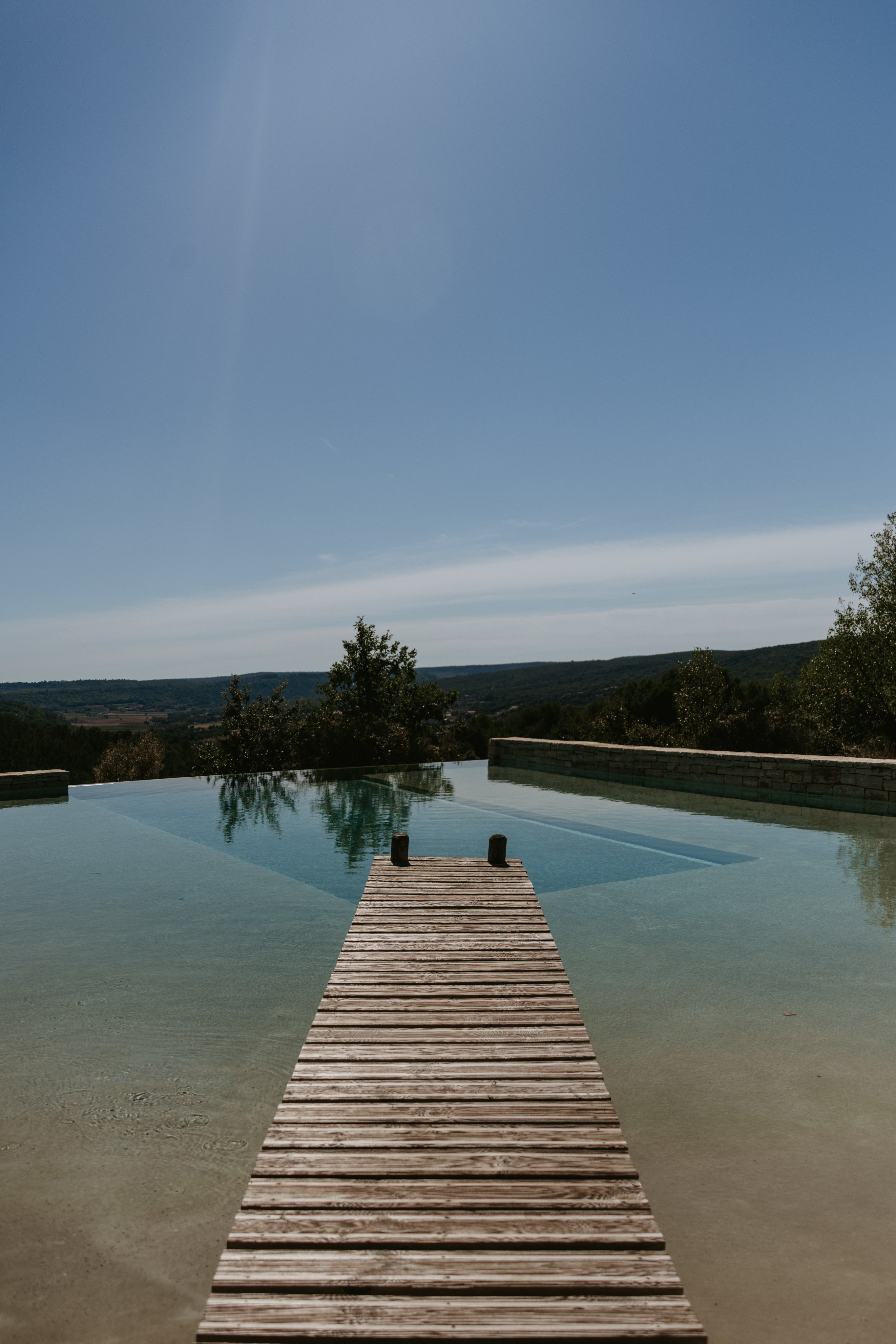 Cropped photo of the exterior of the top floor of an old stone building.