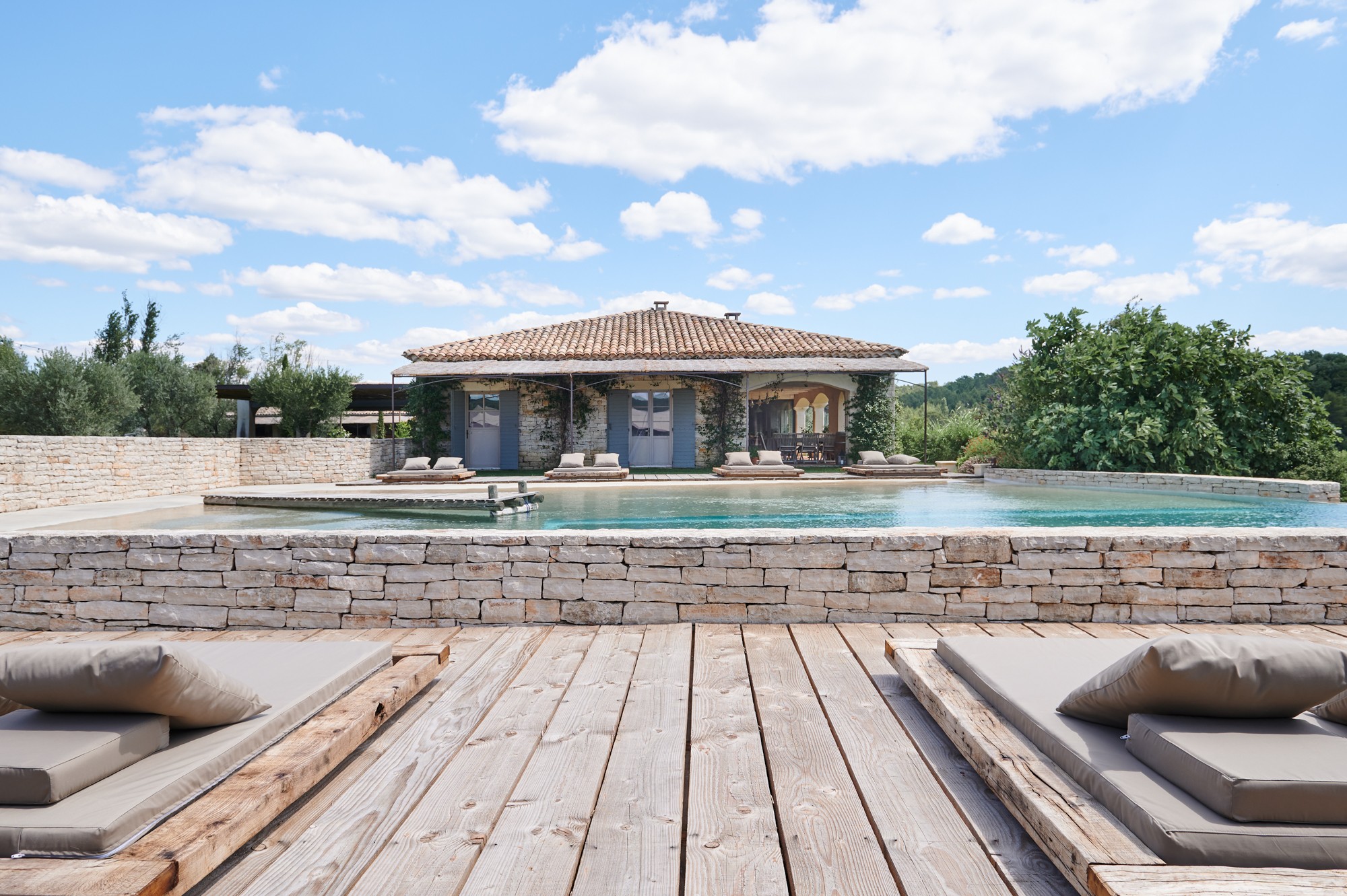 Cropped photo of the exterior of the top floor of an old stone building.